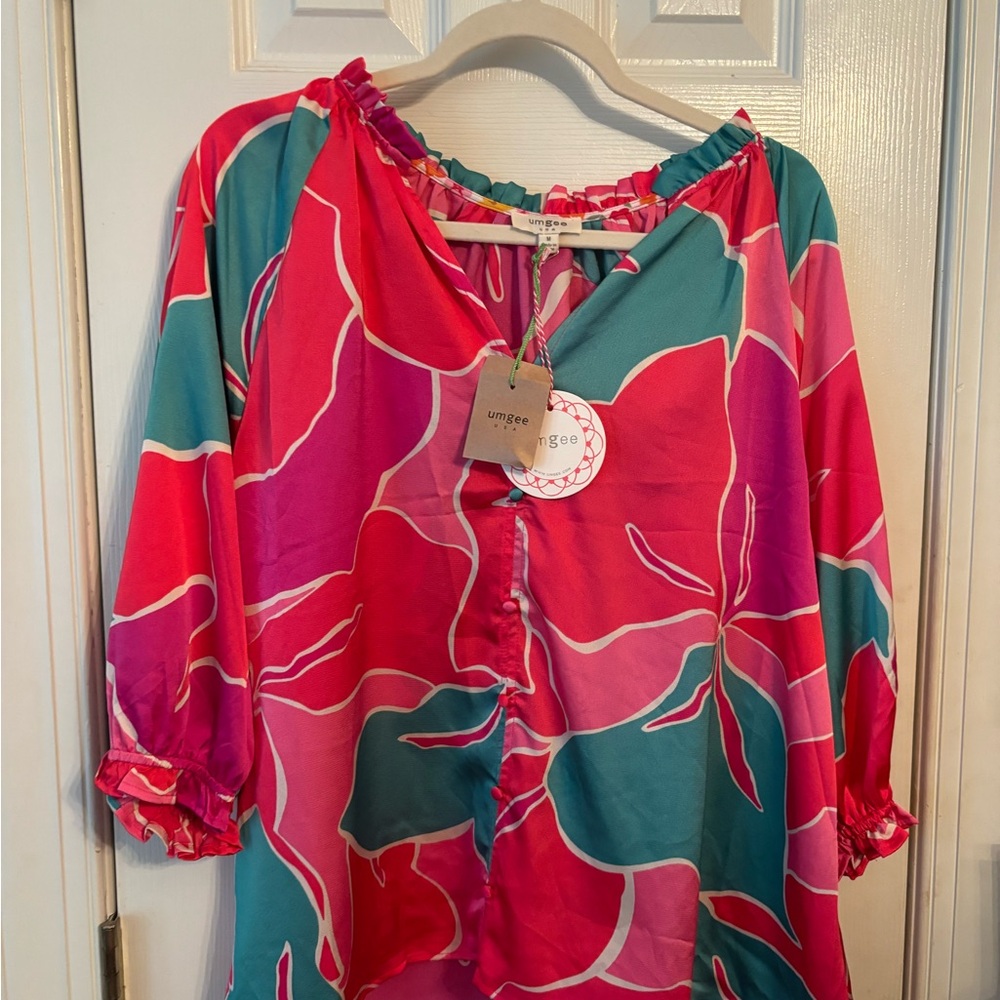 NWT boutique blouse.  Silky feel.